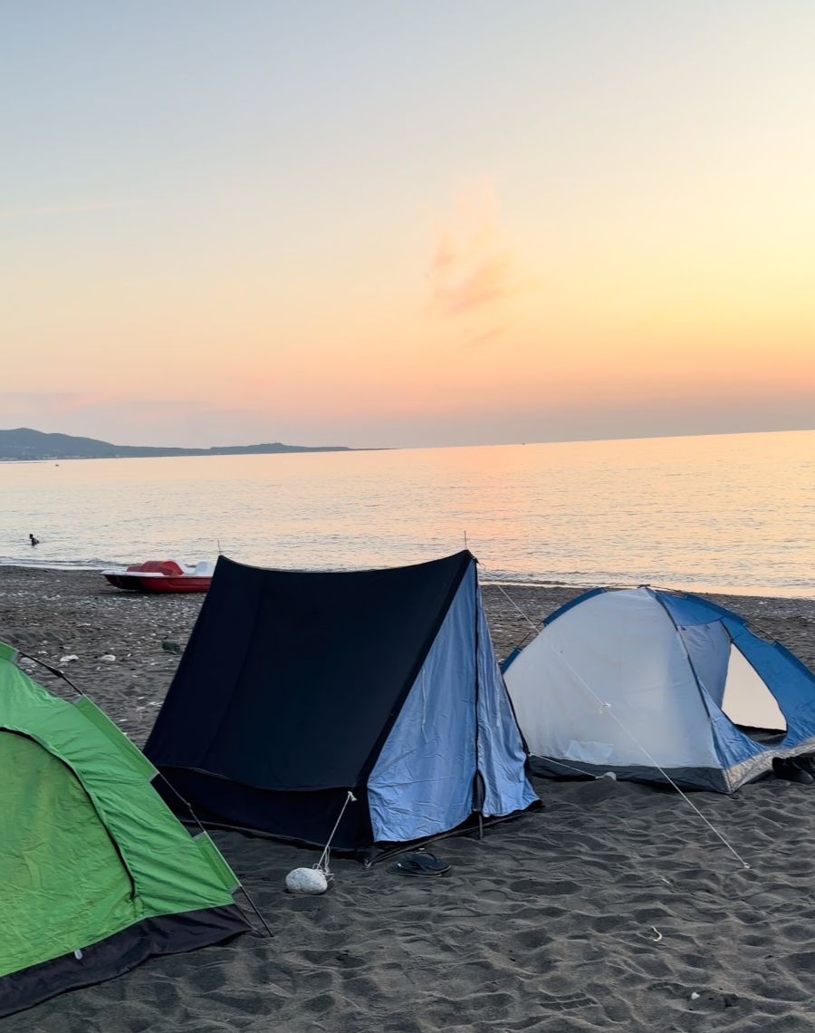 Tents on the beach at sunset on the Syrian coast