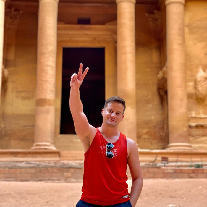 Nick in front of tall columns carved into red rock
